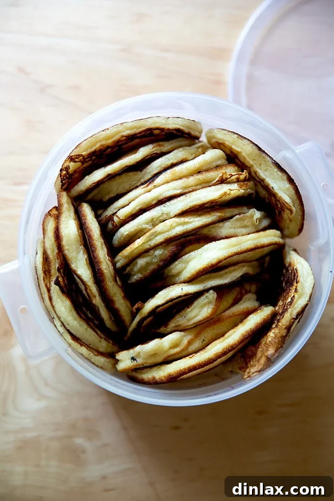 Quick Light and Fluffy Sourdough Discard Pancakes 18 A large container filled with sourdough discard pancakes.