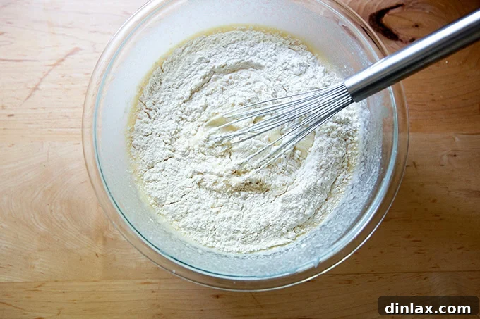 Quick Light and Fluffy Sourdough Discard Pancakes 8 The dry ingredients for sourdough discard pancakes added to the wet ingredients in a large bowl.