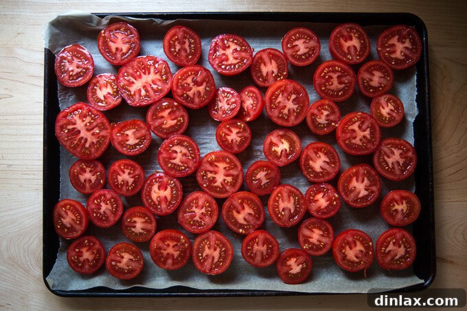 Oven-Dried Tomatoes and Delectable Toasts 5 Halved tomatoes arranged on a parchment-lined baking sheet