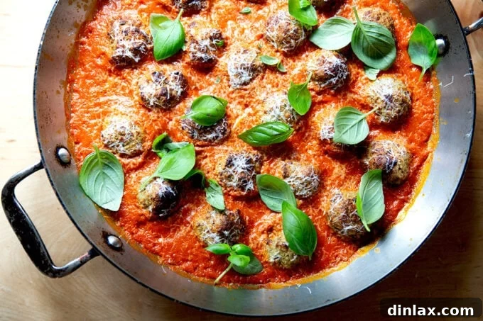 Smoky Eggplant Vegan Meatballs 15 Eggplant meatballs in a skillet topped with fresh basil and parmesan.