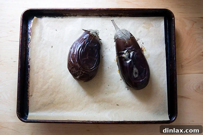 Smoky Eggplant Vegan Meatballs 4 Two roasted eggplants on a sheet pan.