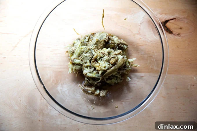 Smoky Eggplant Vegan Meatballs 6 Roasted eggplant flesh in a large bowl.