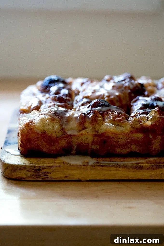 Effortless Cinnamon Sugar Focaccia 25 A side view of the freshly baked and glazed cinnamon-sugar focaccia, showing its impressive height and texture.