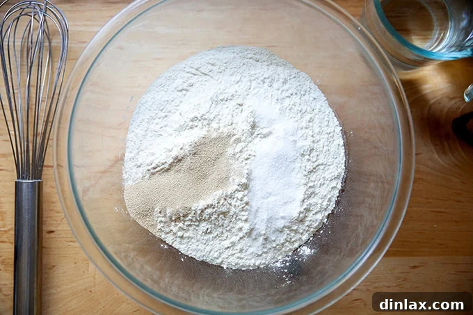 Effortless Cinnamon Sugar Focaccia 4 A mixing bowl filled with a perfectly combined mixture of flour, salt, and yeast, ready for the liquid.