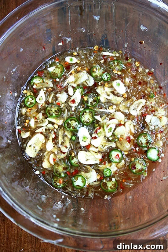 Golden Sesame Tofu with Tangy Nuoc Cham Drizzle 7 A bowl of nuoc cham, showcasing the vibrant colors of the sauce with chilies and garlic.