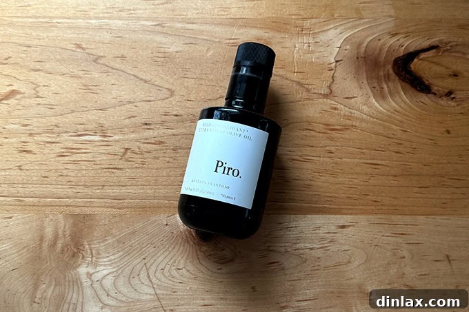 A sleek bottle of Piro extra-virgin olive oil, emphasizing its premium quality and elegant packaging.