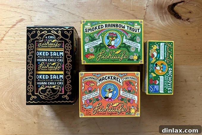 A tastefully arranged collection of Fishwife tinned fish products, highlighting their attractive packaging and gourmet appeal.