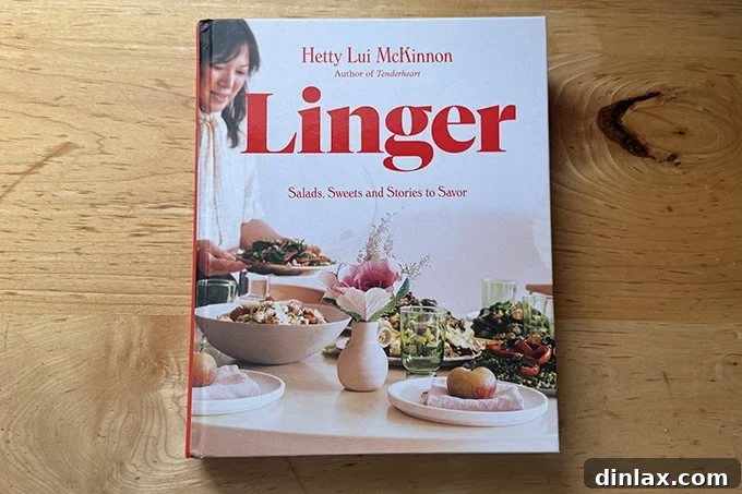 Hetty McKinnon's 'Linger' cookbook, featuring a vibrant cover, inviting readers into its world of salads, sweets, and stories.