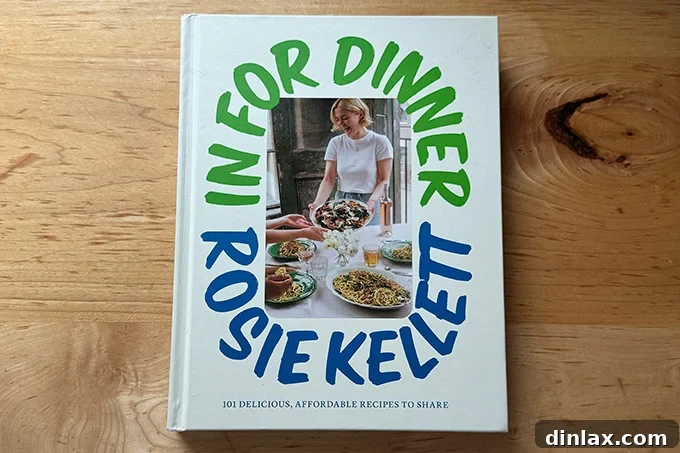 Rosie Kellett's 'In For Dinner' cookbook, with its appealing cover suggesting delicious, affordable recipes for sharing.