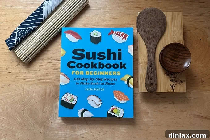 A beginner's sushi cookbook displayed alongside a complete sushi making kit, inviting young chefs to explore Japanese cuisine.