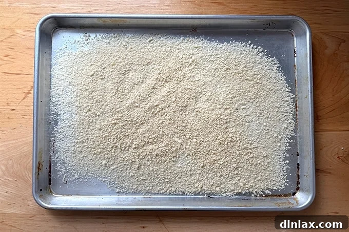 A sheet pan spread with panko bread crumbs. 