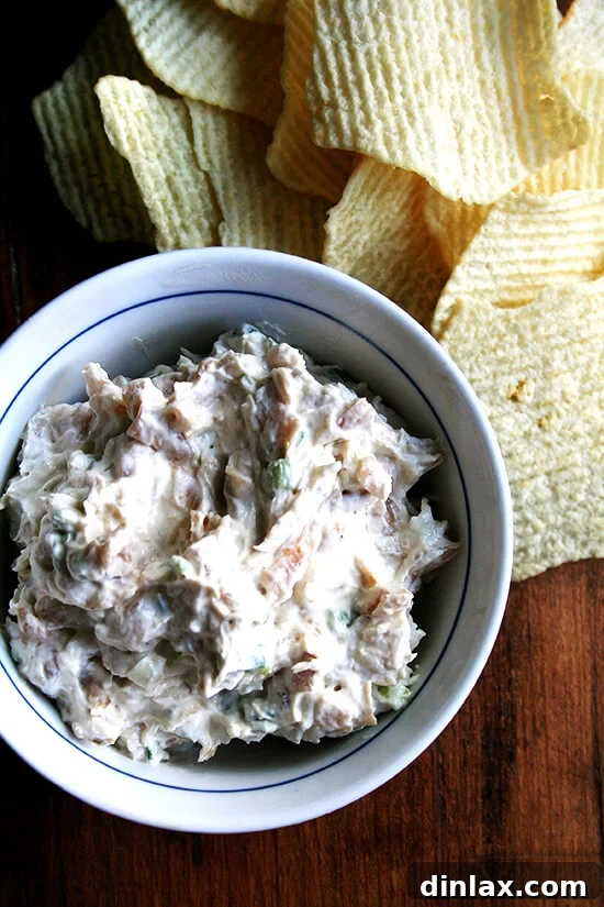 Real sour cream and onion dip recipe. So many of the most-adored party dip recipes call for opening a pack of soup mix filled mostly with dehydrated ingredients, two days worth of the recommended salt intake, MSG and a host of nitrates and preservatives. Fortunately, homemade sour cream and onion dip is astonishingly easy to prepare and far more delicious than its dried-soup variation and throwing together this sweet-and-tangy dip couldn't be much more difficult than opening a box of instant soup. // alexandracooks.com A bowl of real sour cream and onion dip aside Ruffle potato chips.