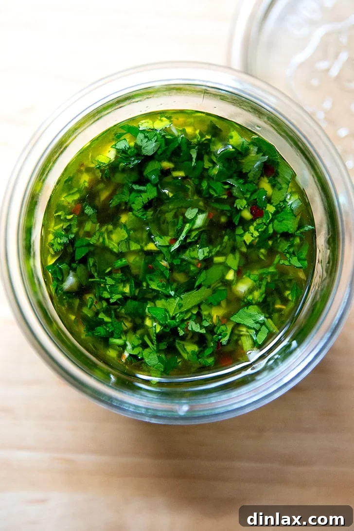 Zesty Homemade Chimichurri 7 The prepared chimichurri sauce transferred into a glass jar for storage, maintaining its freshness.