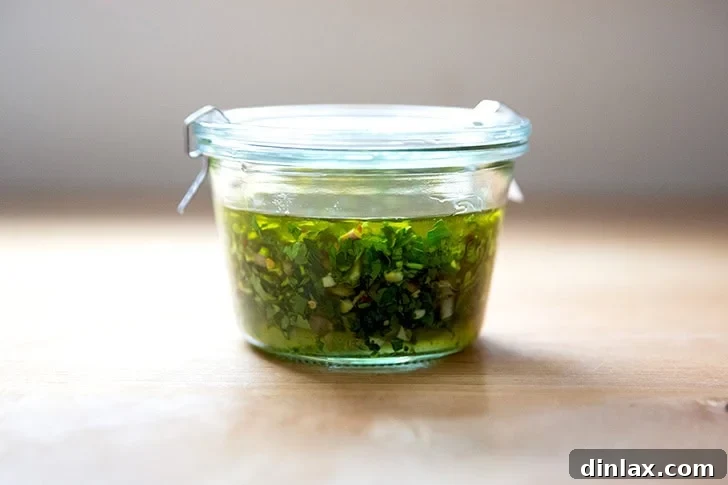 Zesty Homemade Chimichurri 8 A jar of chimichurri stored in the refrigerator, ready for use throughout the week.