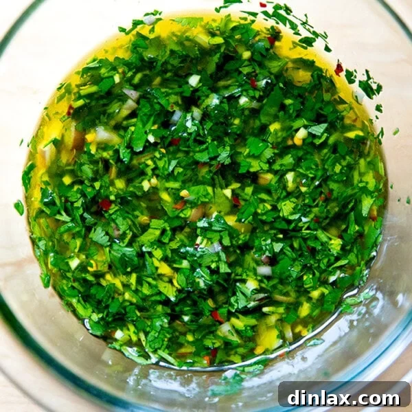 Zesty Homemade Chimichurri 9 A bowl of vibrant homemade chimichurri, perfectly stirred and ready to be served with your favorite dish.