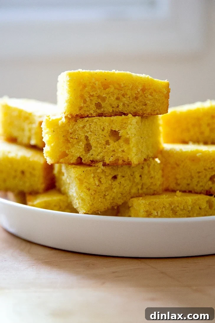 A stack of cornbread pieces on a platter.